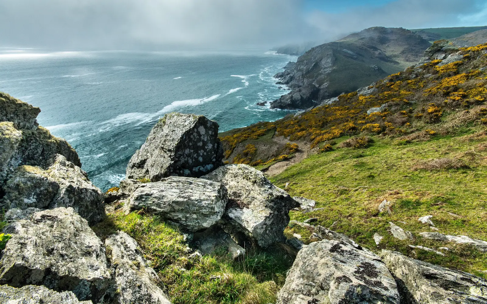 Rugged cliffs and ocean waves in Cornwal